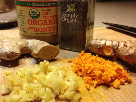 Fresh ginger, fresh turmeric, organic honey & black pepper. Not shown (but essential!): juice of half a lemon.