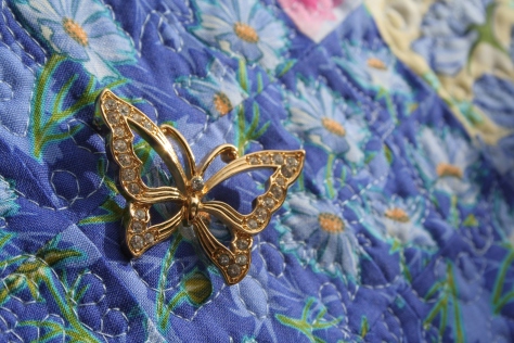 butterfly pins on garden quilt