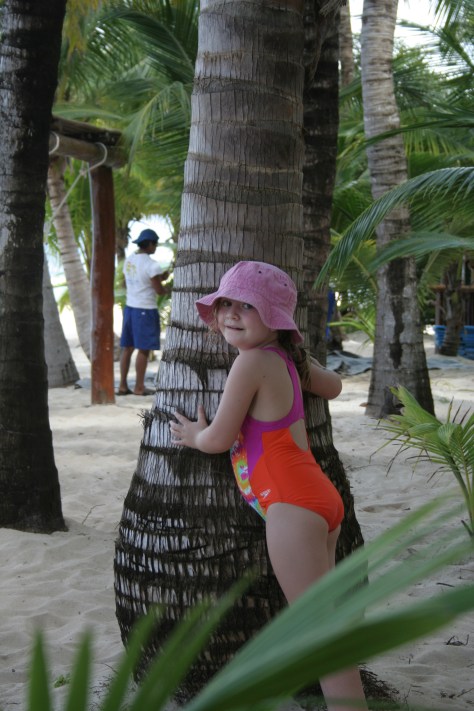 maddie hugging palm tree cozumel mexico