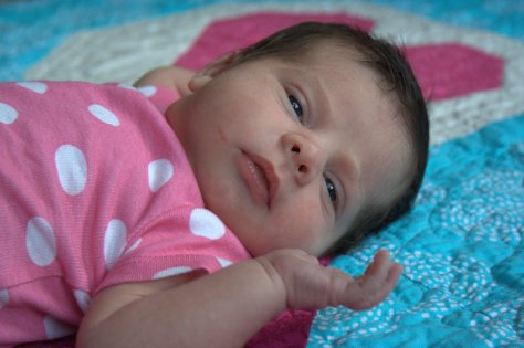 baby reagan on her quilt