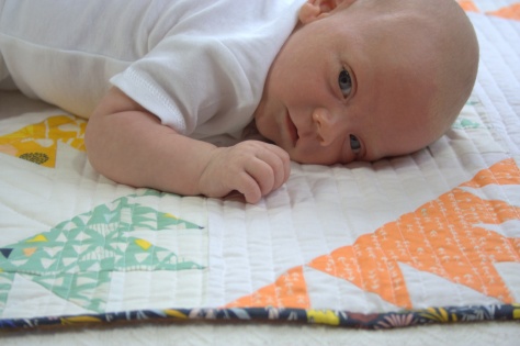 baby on quilt
