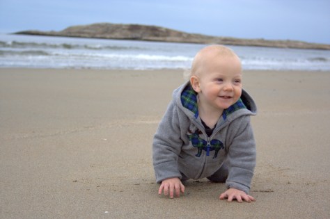 baby crawling on beach