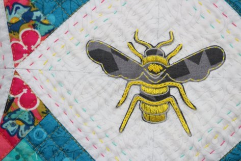 applique embroidered bee from alison glass fabric constant flux detail