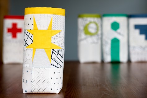 Fabric skinny bin AGF lower the volume capsule yellow wonky star