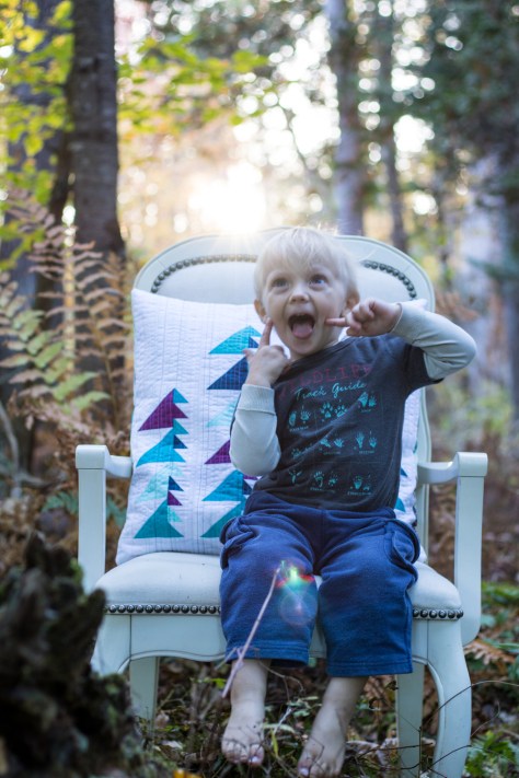 2 year old pillow photo shoot helper