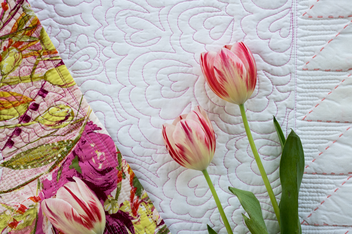 detail of quilting on flying geese table runner cricut maker aurifil thread